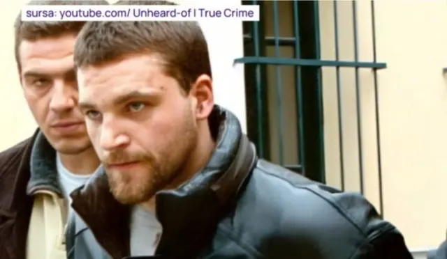 Captură video: bărbat cu barbă, în geacă de piele, însoțit de un alt bărbat